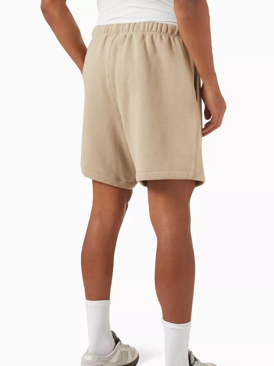 essentials dusty beige flocked logo short